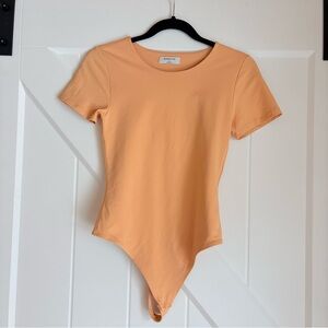 Babaton Creamsicle Orange Short Sleeve Bodysuit Size Medium